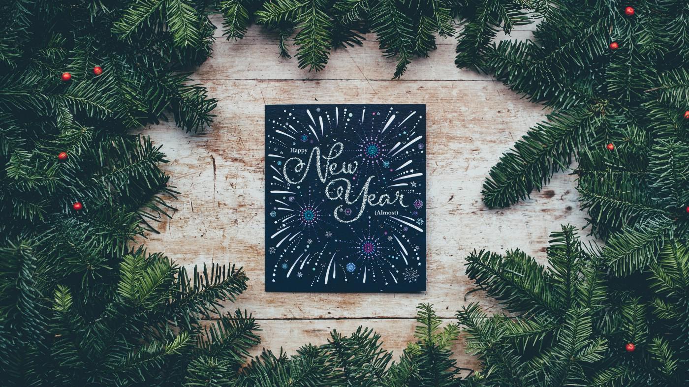 New year card next to tree branches